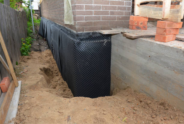 Happy homeowners after waterproofing job in Quantico